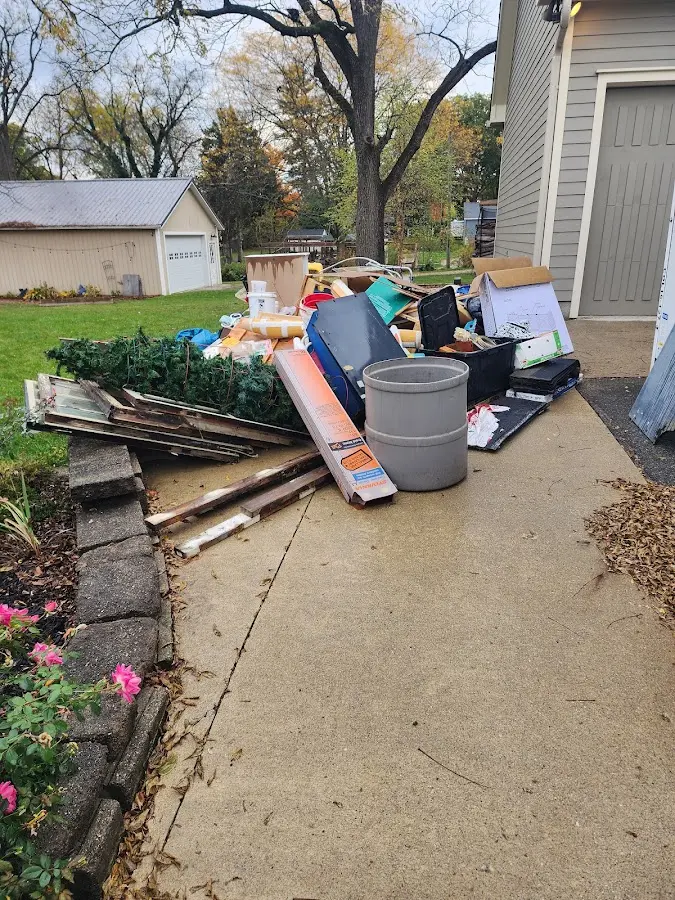 Dumpster being loaded with debris for Demolition Dumpster Rental in Carroll